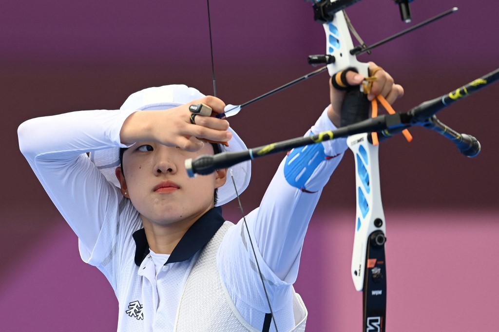 South Korea's An San competes in the women's individual eliminations during the Tokyo 2020 Olympic Games at Yumenoshima Park Archery Field in Tokyo on July 30, 2021.