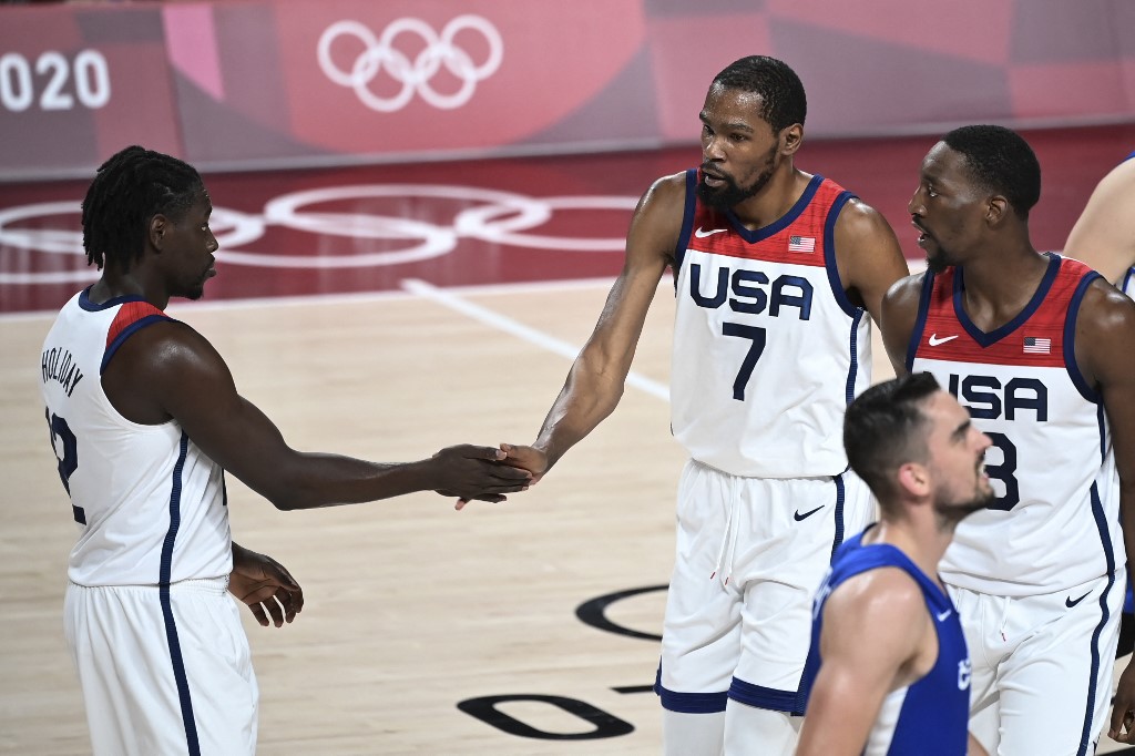USA's Jrue Holiday (L) and USA's Kevin Wayne Durant (C) gesture during the men's preliminary round group A basketball match between USA and Czech Republic during the Tokyo 2020 Olympic Games at the Saitama Super Arena in Saitama on July 31, 2021.