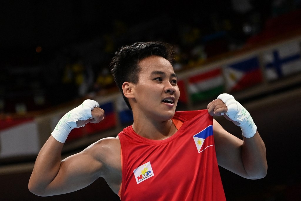Second-placed Philippines' Nesthy Petecio celebrates after the women's feather (54-57kg) boxing final bout against Japan's Sena Irie during the Tokyo 2020 Olympic Games at the Kokugikan Arena in Tokyo on August 3, 2021. 