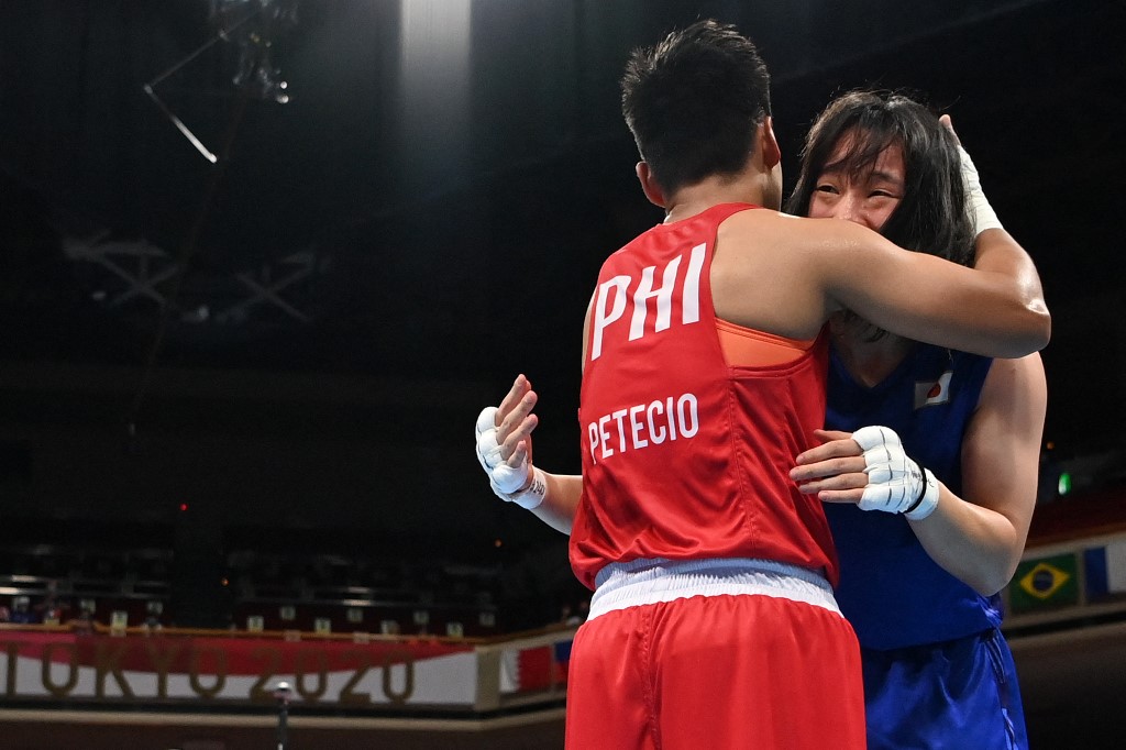 ter winning against Philippines' Nesthy Petecio after their women's feather (54-57kg) boxing final bout during the Tokyo 2020 Olympic Games at the Kokugikan Arena in Tokyo on August 3, 2021. 