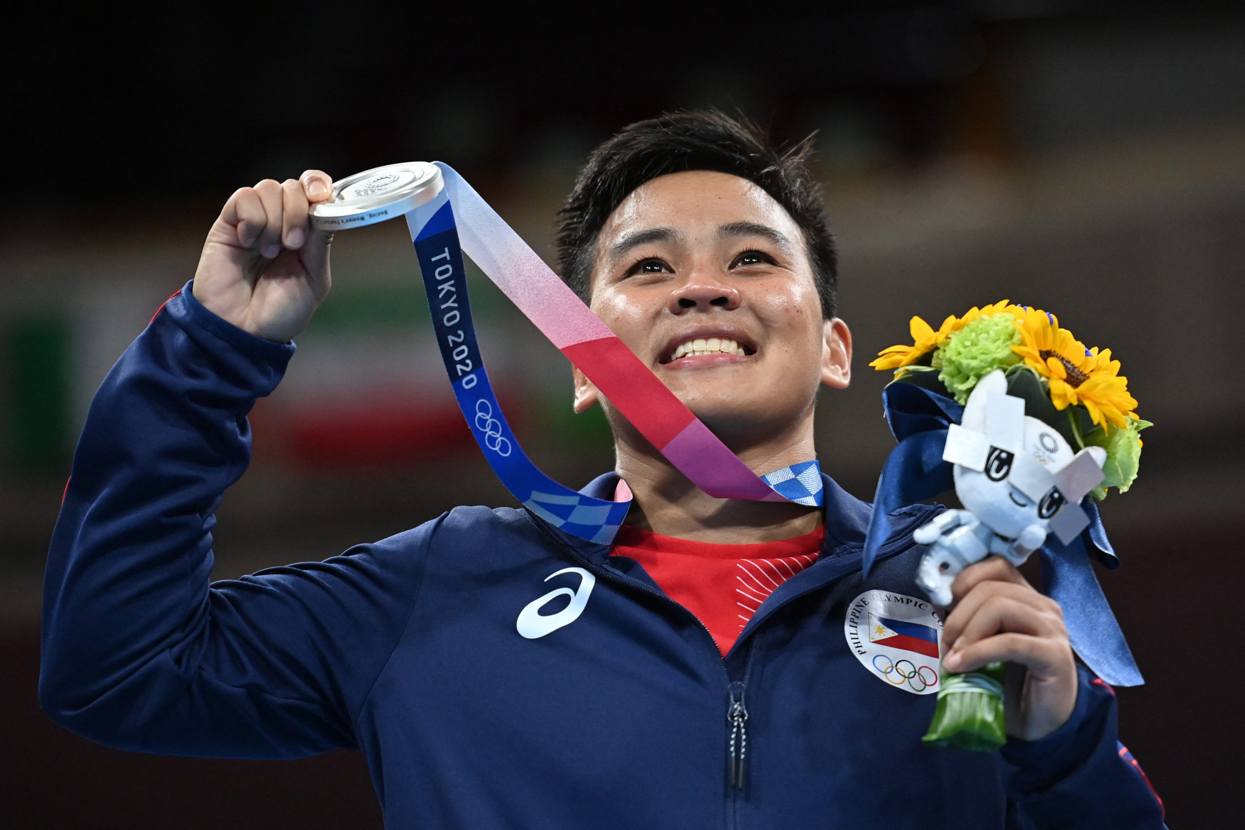 Silver medallist Philippines' Nesthy Petecio poses on the podium with her medal after the women's feather (54-57kg) boxing final bout during the Tokyo 2020 Olympic Games at the Kokugikan Arena in Tokyo on August 3, 2021.