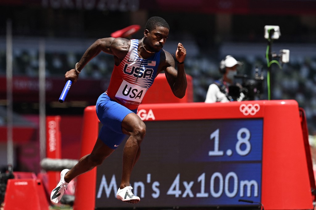 USA's Trayvon Bromell competes in   the men's 4x100m relay heats during the Tokyo 2020 Olympic Games at the Olympic Stadium in Tokyo on August 5, 2021. 