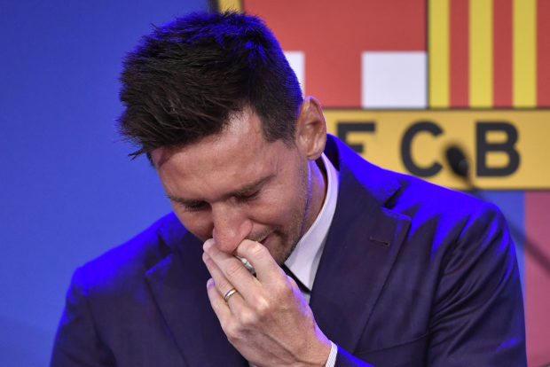 Barcelona's Argentinian forward Lionel Messi cries during a press conference at the Camp Nou stadium in Barcelona on August 8, 2021. - Messi fought back tears as he began a press conference at which he confirmed he is leaving Barcelona, where he has played his entire career.