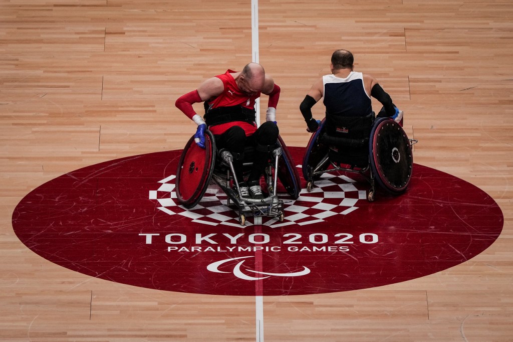 A Danish wheelchair rugby player (L) a British wheelchair rugby player attend a training session at Yoyogi National Stadium in Tokyo ahead of the Tokyo 2020 Paralympic Games on August 22, 2021.