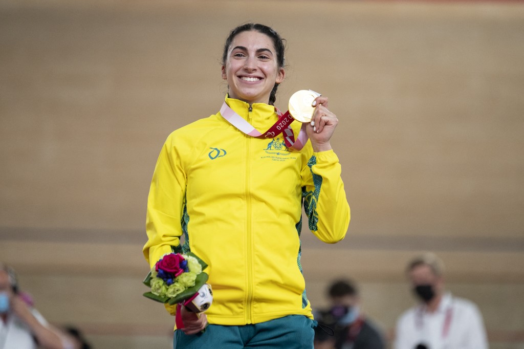 Gold medallist Australia's Paige Greco poses with her medal on the podium after the women's C1 3000m individual pursuit event during the Tokyo 2020 Paralympic Games at Izu Velodrome in Izu on August 25, 2021.