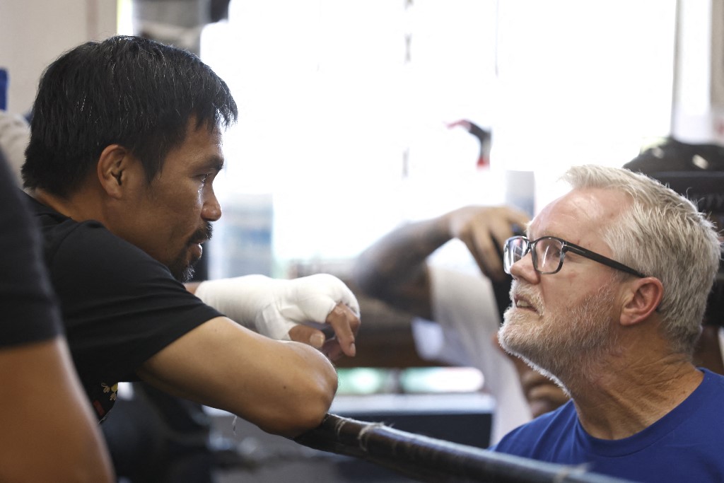 Manny Pacquiao (L) talks with his coach, Freddie Roach, at Wild Card Boxing Club on August 04, 2021 in Los Angeles, California ahead of his fight against Errol Spence Jr. on Aug. 21 at T-Mobile Arena in Las Vegas. 