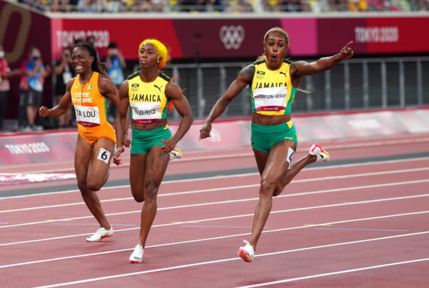Tokyo 2020 Olympics - Athletics - Women's 100m - Final - OLS - Olympic Stadium, Tokyo, Japan - July 31, 2021. Elaine Thompson-Herah of Jamaica celebrates after winning gold 
