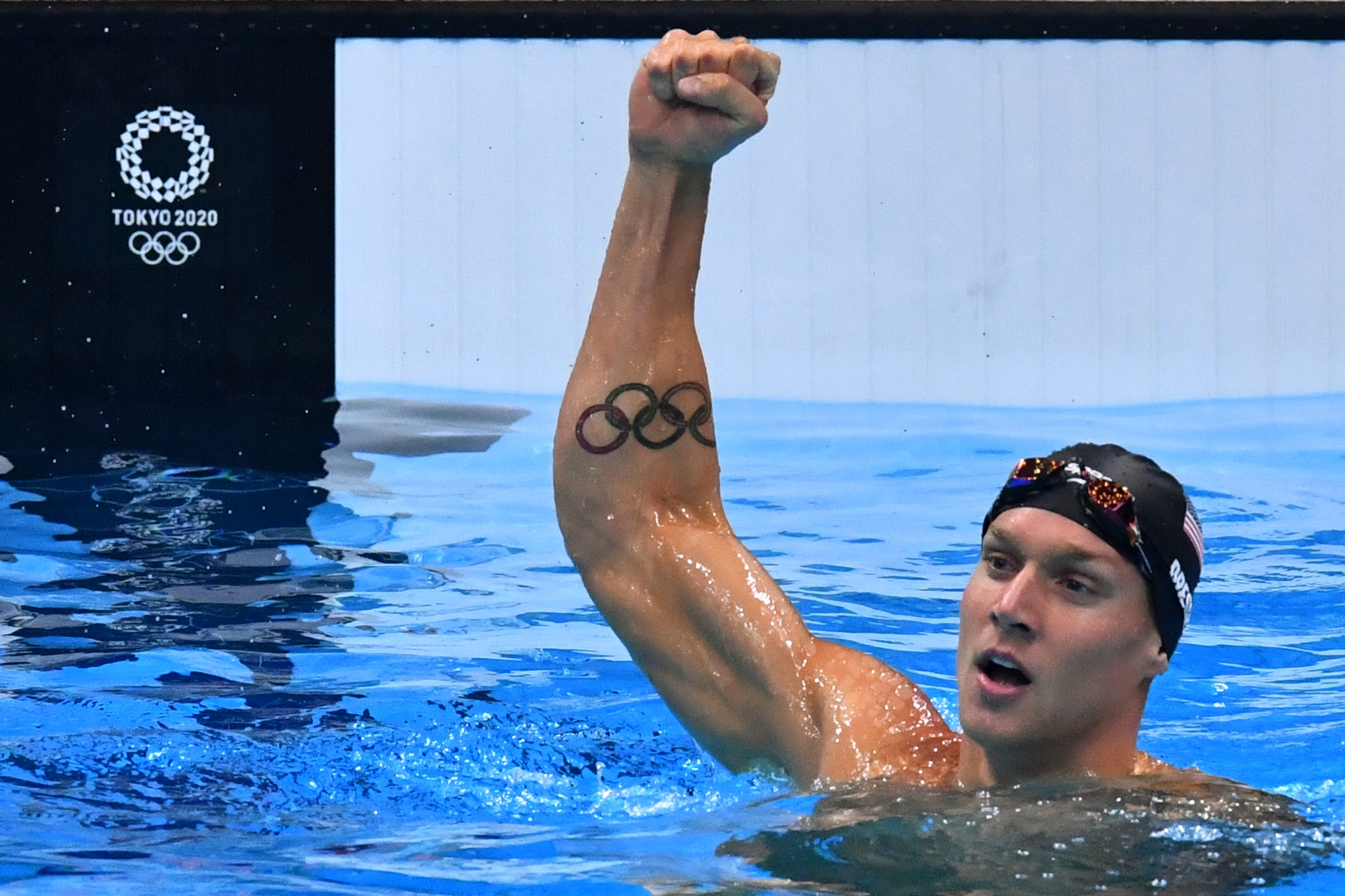Caeleb Dressel of the United States reacts after winning 