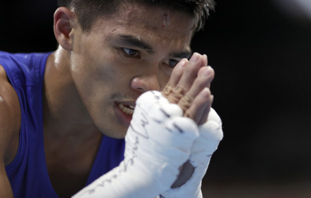 Carlo Paalam of the Philippines bows after his fight against Ryomei Tanaka of Japan