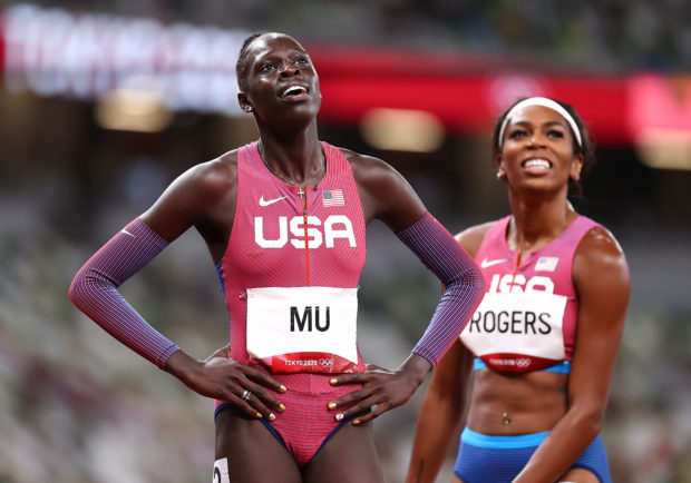 Athing Mu of the United States reacts after crossing the line first to win gold, next to Raevyn Rogers of the United States who won bronze REUTERS/Lucy Nicholson