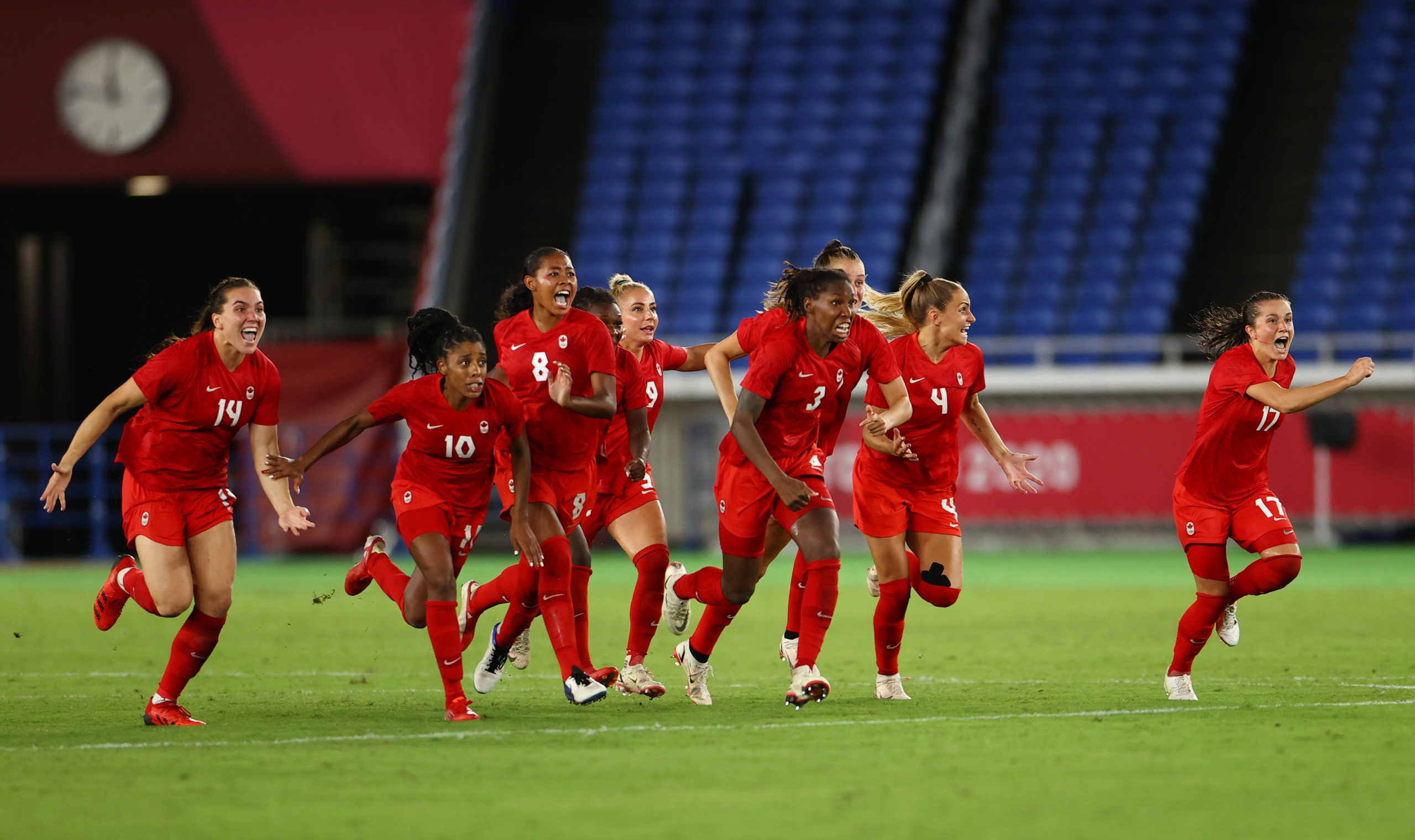 Canada celebrate winning the penalty shootout and the gold medal. 