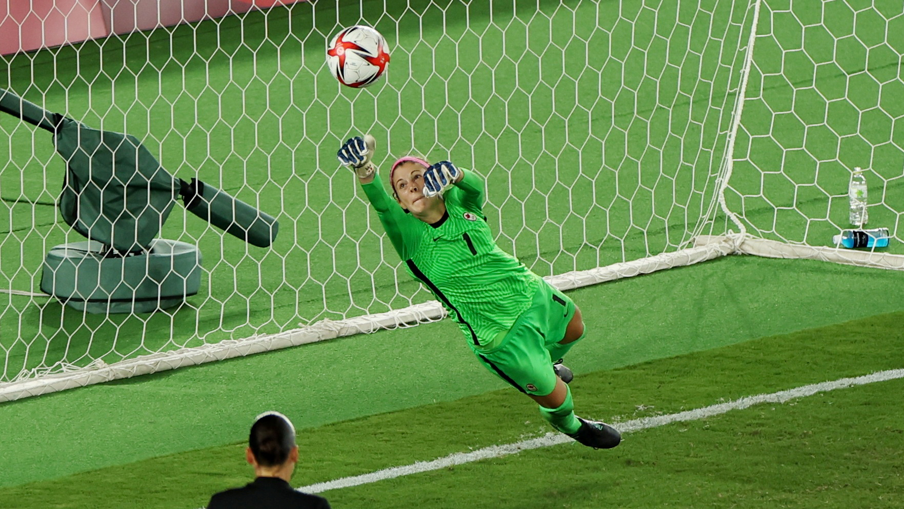 Stephanie Labbe of Canada saves a penalty from Anna Anvegard of Sweden during the penalty shoot-out 