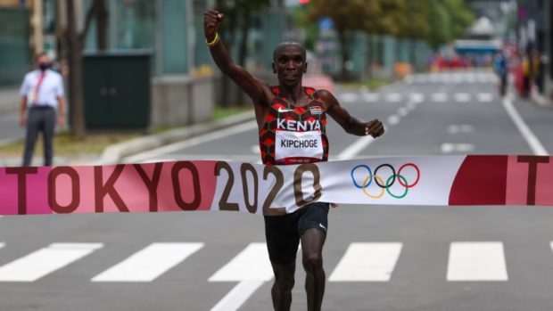  Eliud Kipchoge of Kenya crosses the finish line to win gold REUTERS/Kim Hong-Ji
