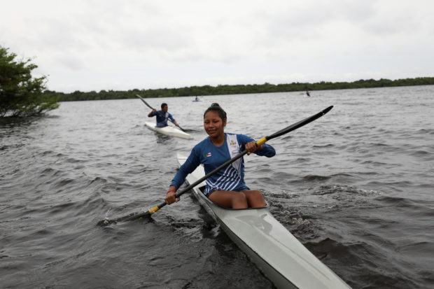 The Kambeba indigenous, Thais Pontes de Araujo, 15, takes part in a canoeing class as part of the Indigenous Canoeing project of the Brazilian Canoeing Confederation (CBCa) and the Sustainable Amazon Foundation (FAS) on Cueiras river, an affluent of the Negro River in Manaus, Amazonas state, Brazil