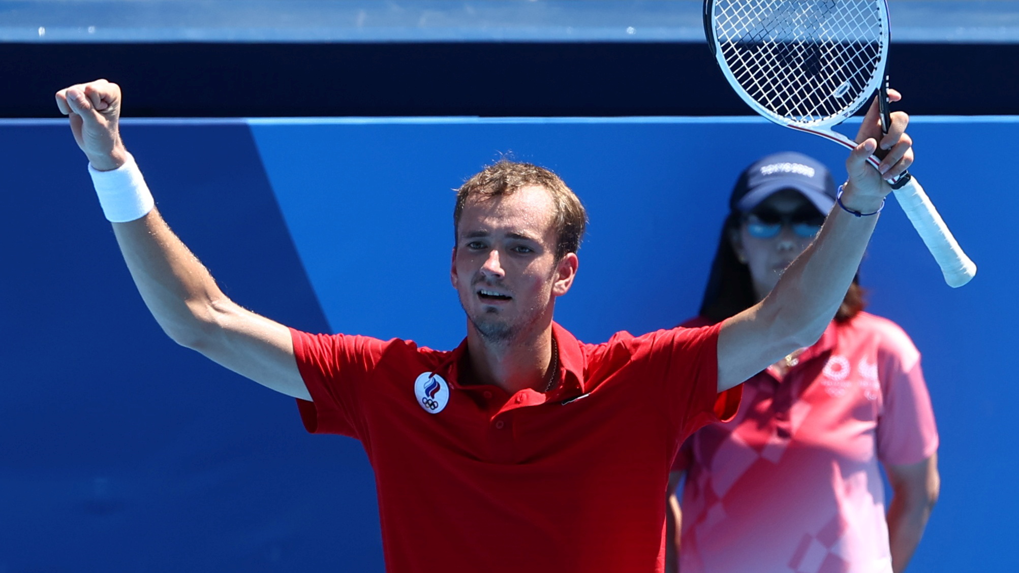Daniil Medvedev of the Russian Olympic Committee celebrates after winning his third round match against Fabio Fognini of Italy