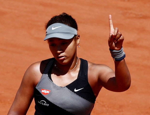 Tennis - French Open - Roland Garros, Paris, France - May 30, 2021 Japan's Naomi Osaka reacts during her first round match against Romania's Patricia Maria Tig REUTERS/Christian Hartmann