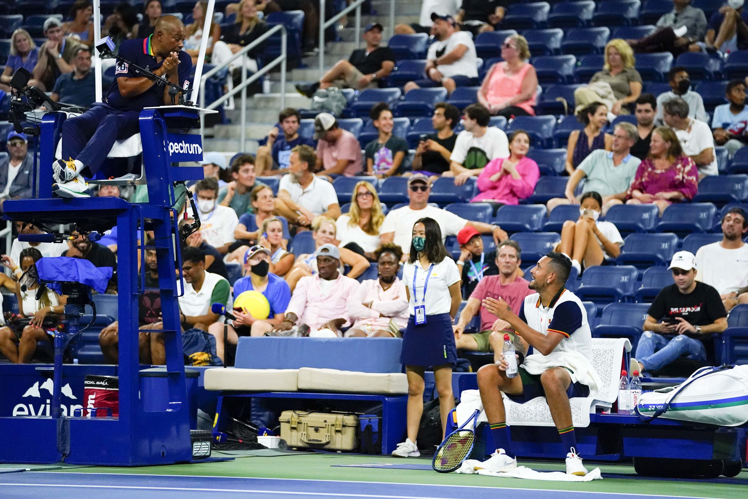 Nick Kyrgios of Australia and the chair umpire talk during the first round match against Roberto Bautista Agut of Spain on day one of the 2021 U.S. Open tennis tournament at USTA Billie King National Tennis Center.