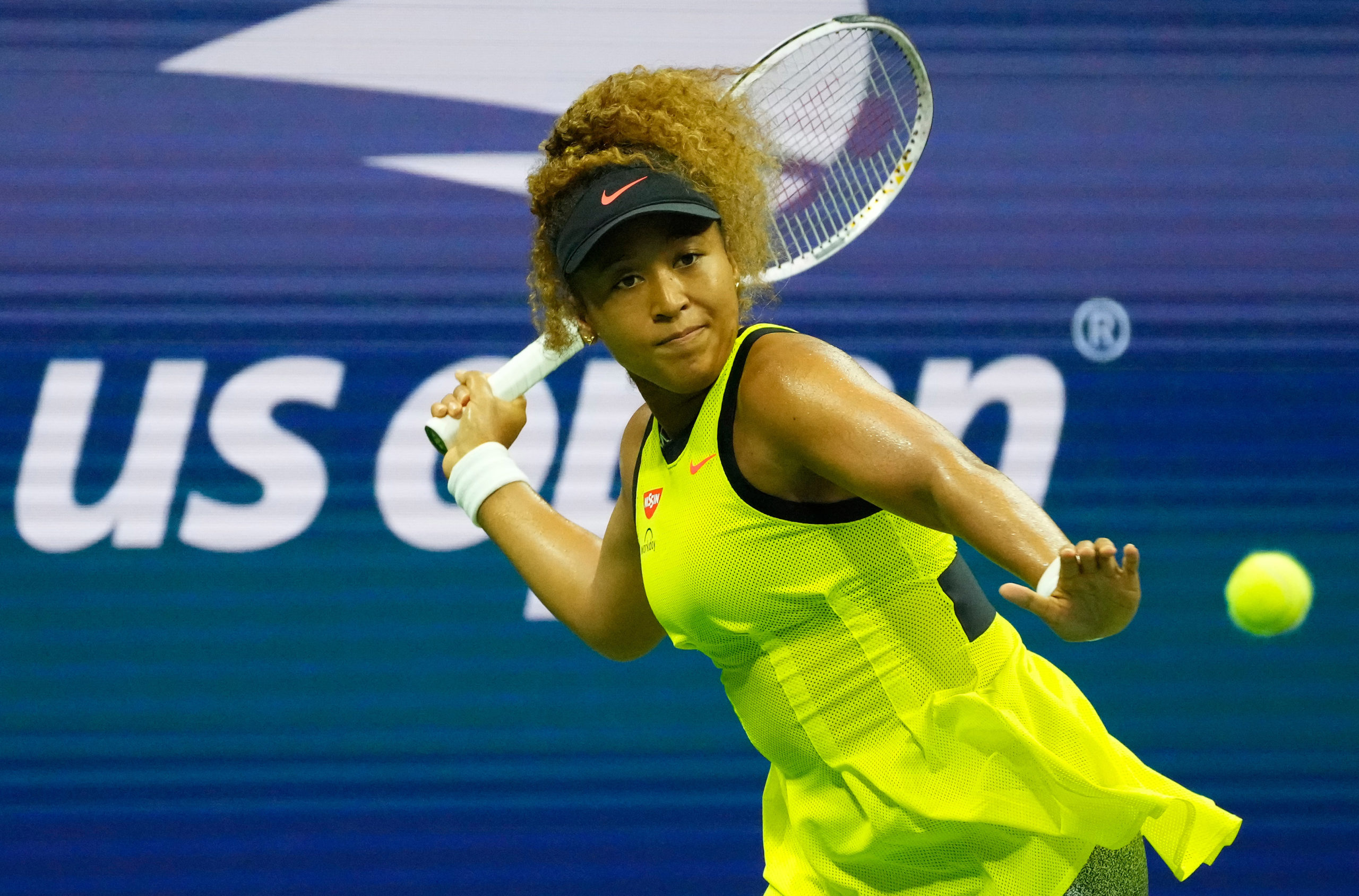  Naomi Osaka of Japan hits to Marie Bouzkova of the Czech Republic on day one of the 2021 U.S. Open tennis tournament at USTA Billie King National Tennis Center. 