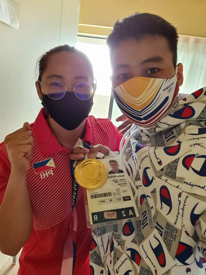 Filipino boxer Nesthy Petecio poses for a photo with weightlifter Hidilyn Diaz, who won the country's first gold medal in the Tokyo Olympics