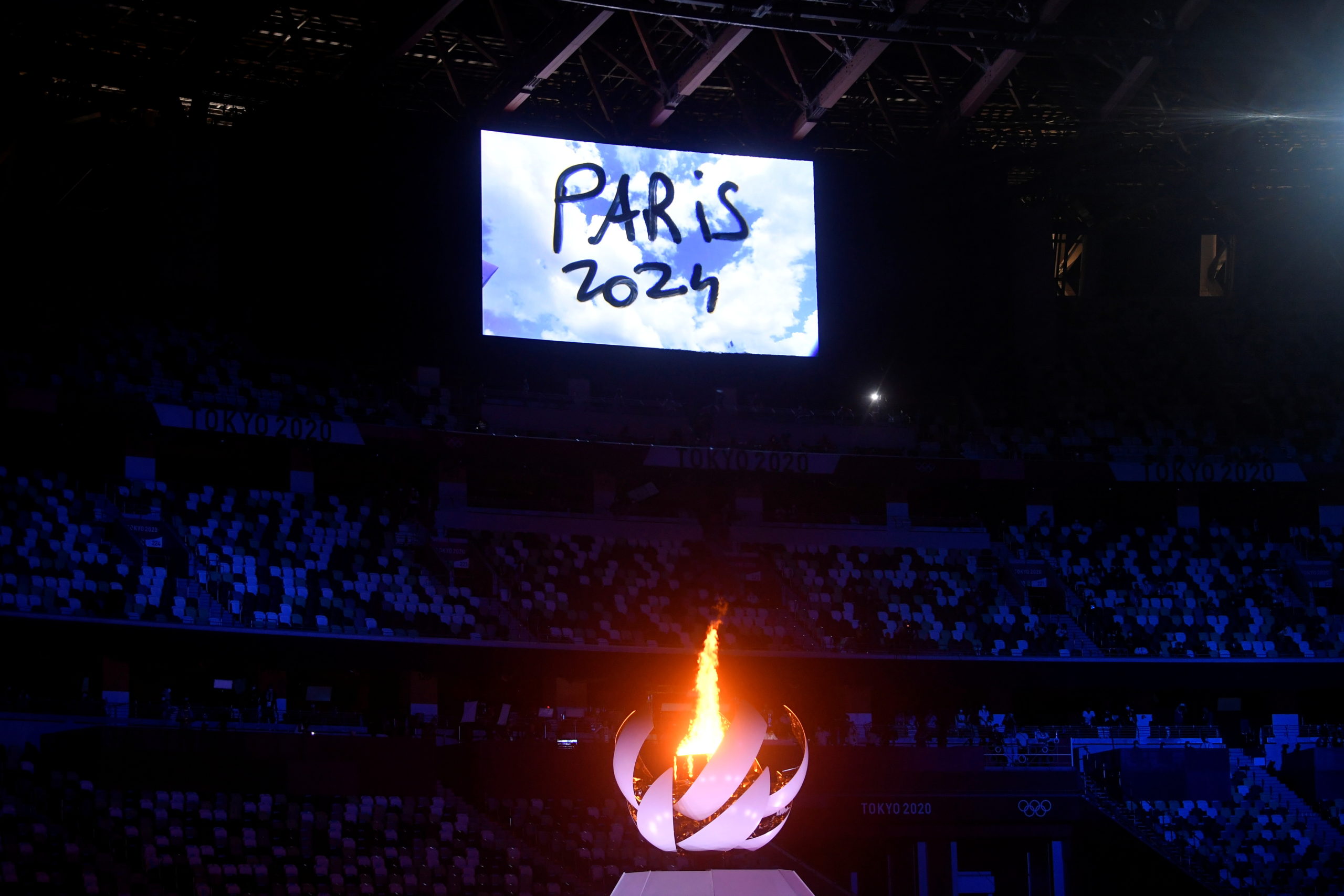 The Olympic torch seen lit for the last time as Paris takes over the next hosting.