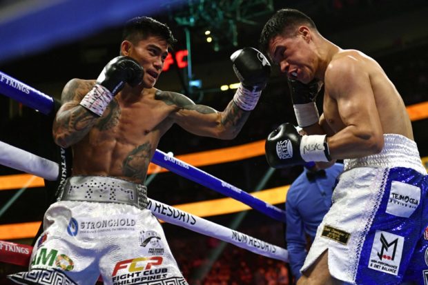 Mark Magsayo (L) of the Philippines fights against Julio Ceja of Mexico during the WBA Featherweight Title Eliminator boxing match at T-Mobile Arena in Las Vegas, Nevada on August 21, 2021.