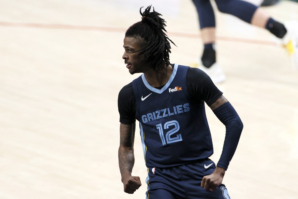 Ja Morant #12 of the Memphis Grizzlies reacts after his dunk on April 25, 2021.