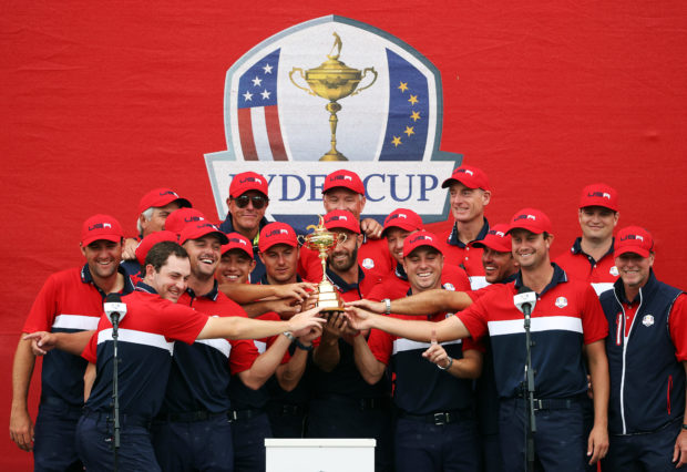 Team United States celebrates with the Ryder Cup after defeating Team Europe 19 to 9 during Sunday Singles Matches of the 43rd Ryder Cup at Whistling Straits on September 26, 2021 in Kohler, Wisconsin. 