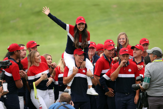 Members of team United States and their significant others celebrate with the Ryder Cup after defeating Team Europe 19 to 9 to win the 43rd Ryder Cup at Whistling Straits on September 26, 2021 in Kohler, Wisconsin.   