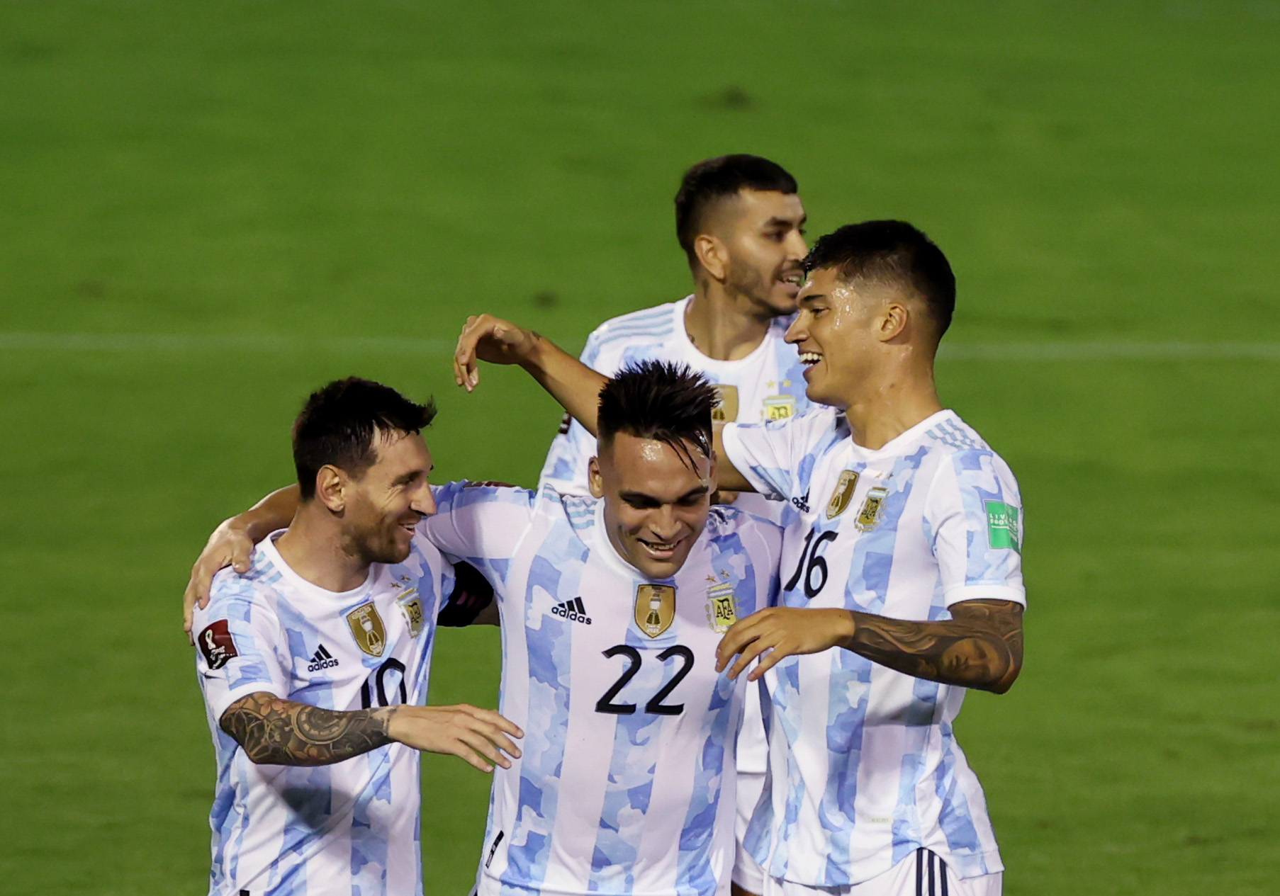 Argentina's Joaquin Correa celebrates scoring their second goal with Lionel Messi and Lautaro Martinez