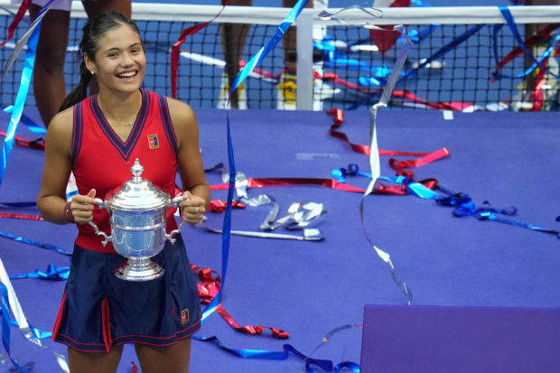 Emma Raducanu of Great Britain celebrates with the championship trophy after her match against Leylah Fernandez of Canada (not pictured) in the women's singles final on day thirteen of the 2021 U.S. Open tennis tournament at USTA Billie Jean King National Tennis Center. Mandatory Credit: Danielle Parhizkaran-USA TODAY Sports/File photo