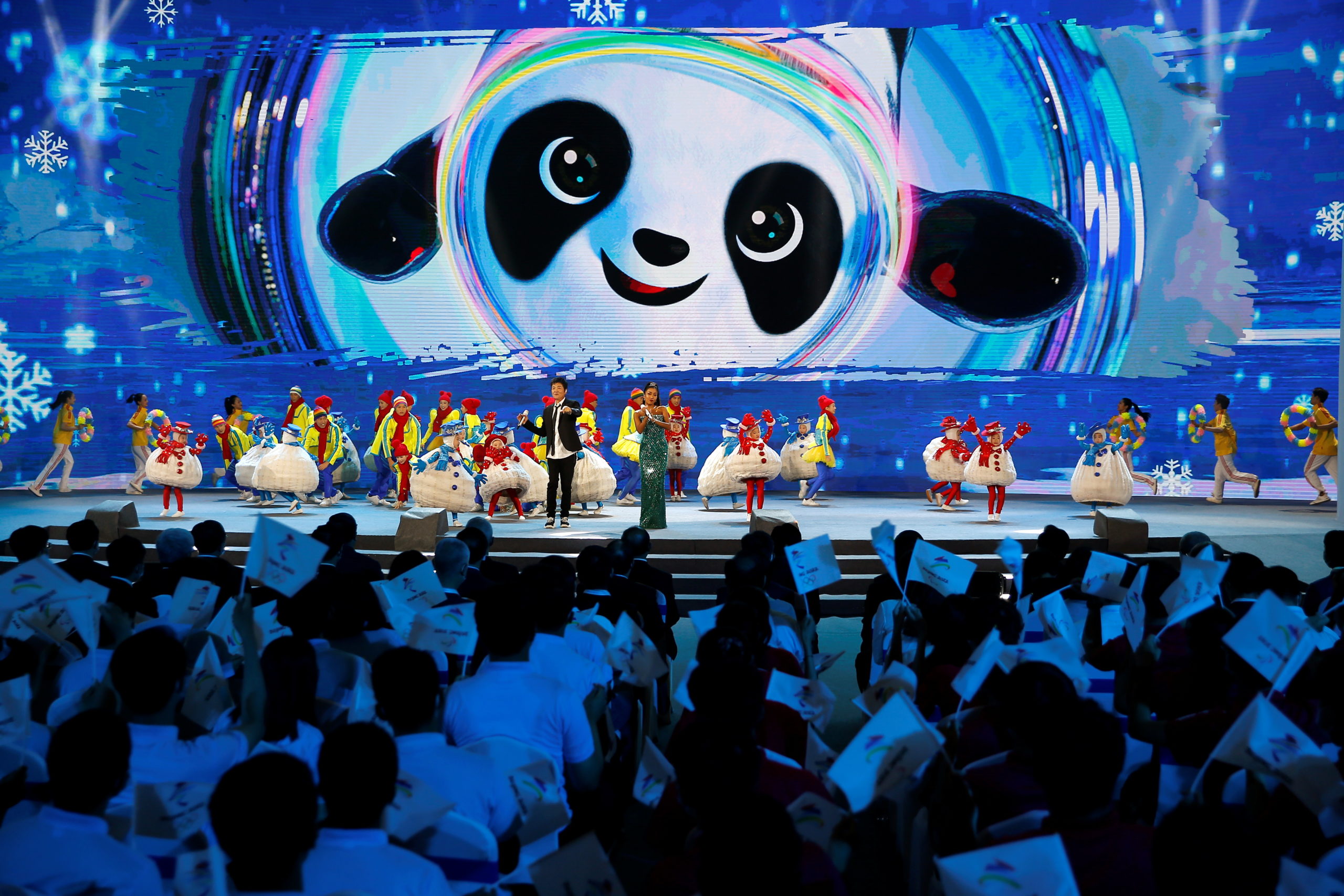 Singers perform on stage at a ceremony unveiling the slogan for Beijing 2022 Winter Olympics, in Beijing, China 