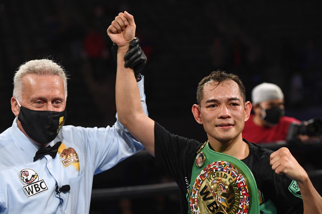 Filipino boxer Nonito Donaire (R) celebrates after knocking out French boxer Nordine Oubaali after winning the Bantamweight World Championship boxing match at Dignity Health Sports Park on May 29, 2021 in Carson, California.