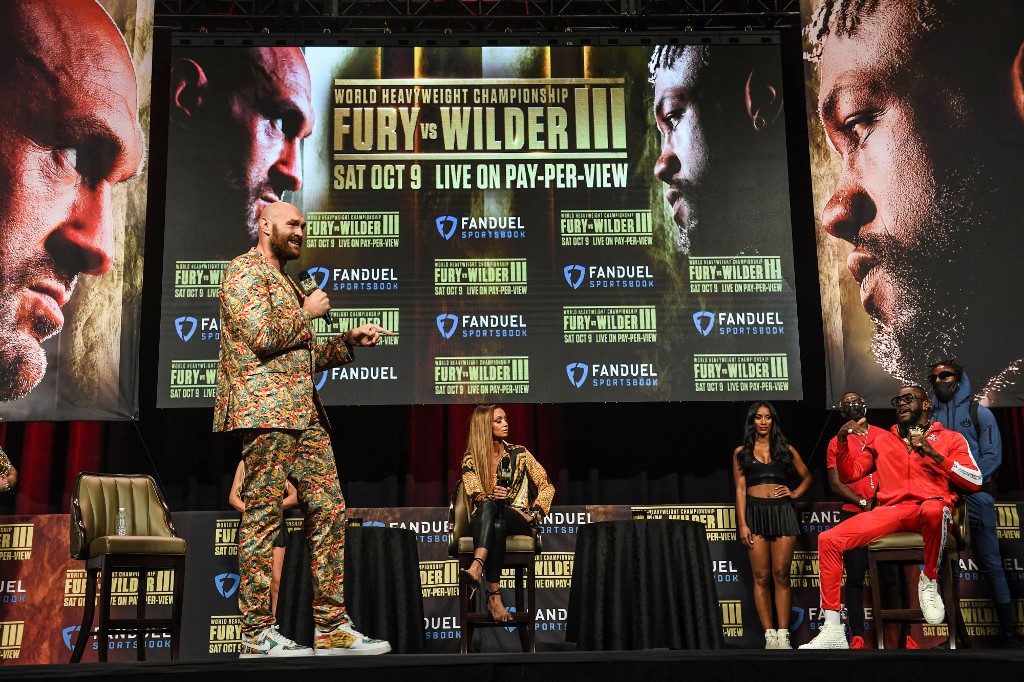 Tyson Fury (L) and challenger Deontay Wilder attend a press conference for their WBC heavyweight championship fight, October 6, 2021 at the MGM Grand Garden Arena in Las Vegas, Nevada ahead of their October 9, 2021 fight