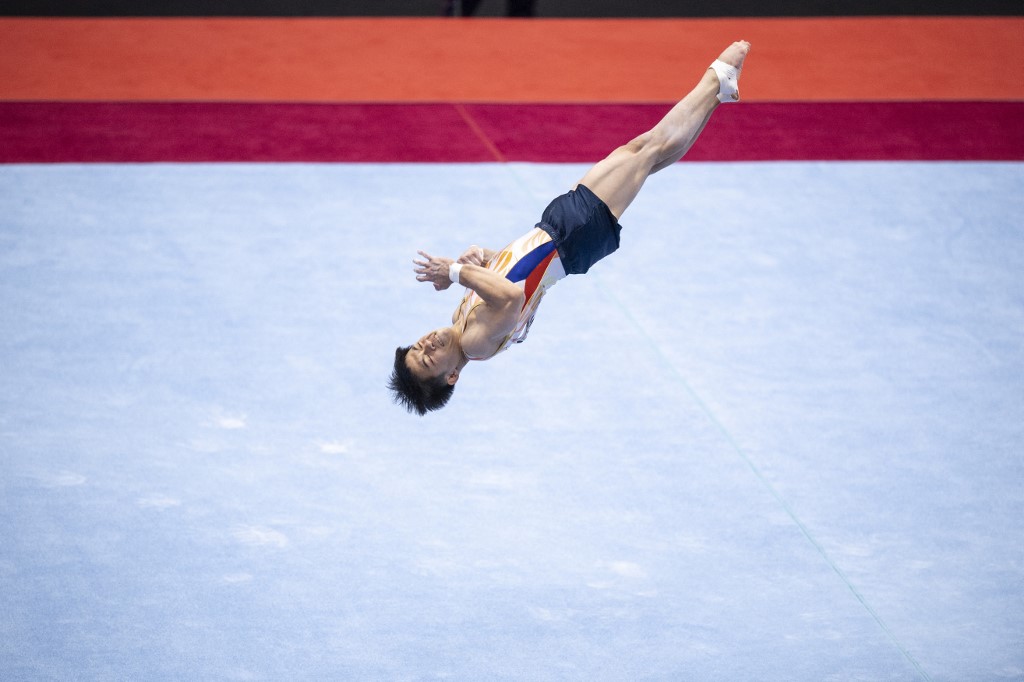 Philippines' Carlos Edriel Yulo competes in the floor event at the mens team qualification during the Artistic Gymnastics World Championships at the Kitakyushu City Gymnasium in Kitakyushu, Fukuoka prefecture on October 20, 2021. (Photo by Charly TRIBALLEAU / AFP)