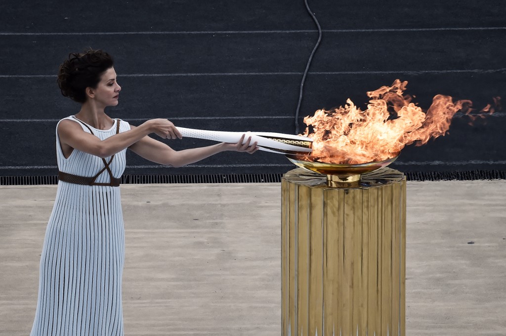 Actress Katerina Lechou, performing a high priestess lights the olympic torch, at The Panathenaic Stadium in Athens on October 31, 2017, during the handover ceremony of the Olympic flame for the 2018 Winter Olympics in Pyeongchang, South Korea. 