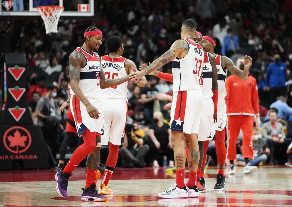 TORONTO, ON - OCTOBER 20: Bradley Beal #3 and Kyle Kuzma #33 of the Washington Wizards celebrate during the second half of their basketball game against the Toronto Raptors at Scotiabank Arena on October 20, 2021 in Toronto, Canada.