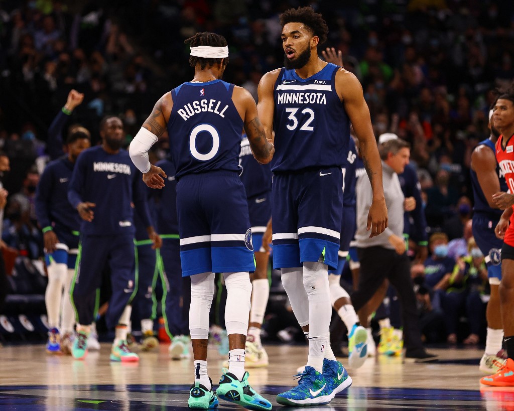Karl-Anthony Towns #32 and D'Angelo Russell #0 of the Minnesota Timberwolves during the game against the Houston Rockets at Target Center on October 20, 2021 in Minneapolis, Minnesota.