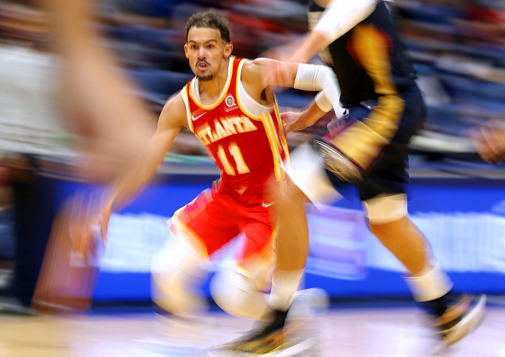 Trae Young #11 of the Atlanta Hawks drives against Jonas Valanciunas #17 of the New Orleans Pelicans during the second half at the Smoothie King Center on October 27, 2021 in New Orleans, Louisiana. 