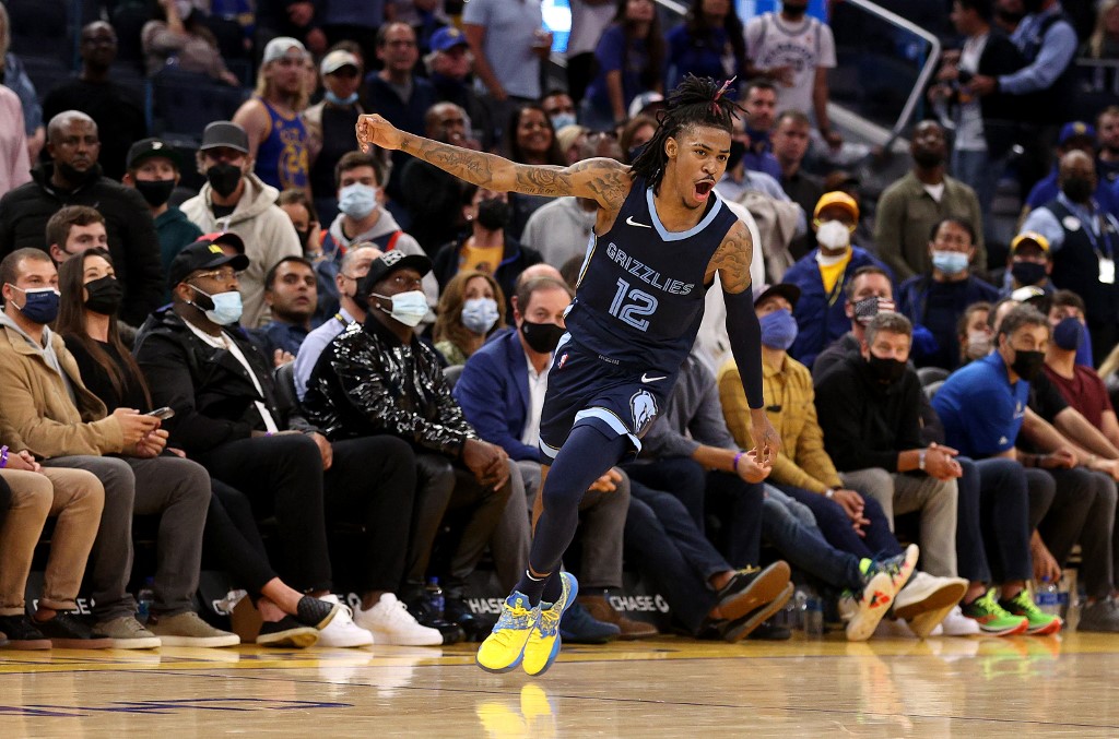 Ja Morant #12 of the Memphis Grizzlies celebrates after they beat the Golden State Warriors in overtime at Chase Center on October 28, 2021 in San Francisco, California. 