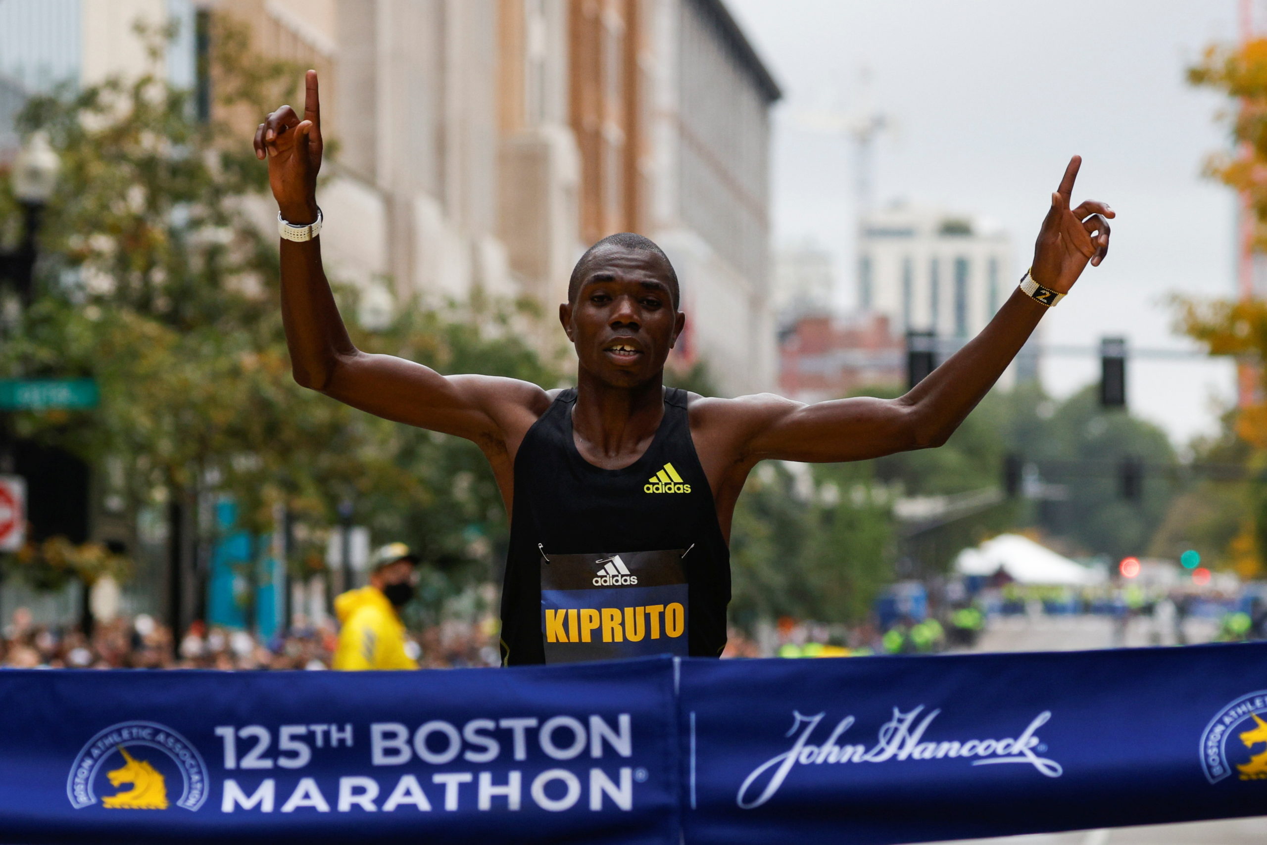 Benson Kipruto of Kenya crosses the finish line to win the men's division of the 125th Boston Marathon in Boston, Massachusetts, U.S., October 11, 2021. REUTERS/Brian Snyder