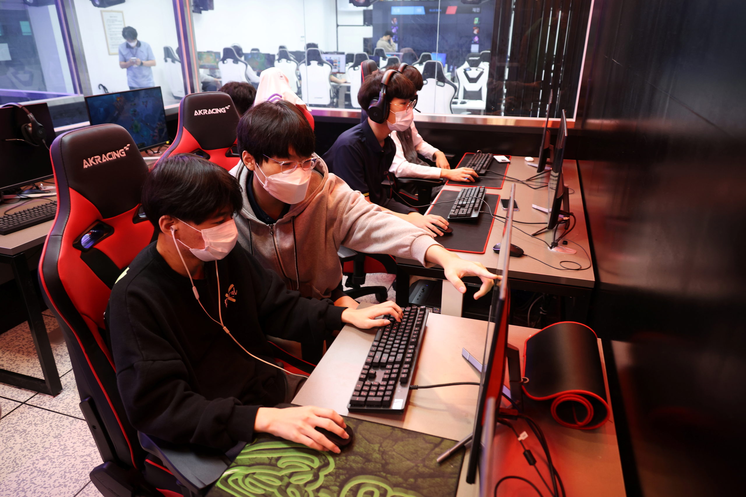 Yoon Ki-chan, majoring in esports, guides a friend as they play League of Legends during a class at Eunpyeong Meditech high school in Seoul, South Korea, October 7, 2021. Picture taken on October 7, 2021. 