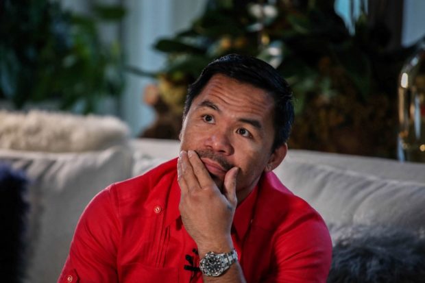 In this photo taken on November 11, 2021, Philippine Senator Manny Pacquiao gestures during an interview with AFP at his residence in Manila
