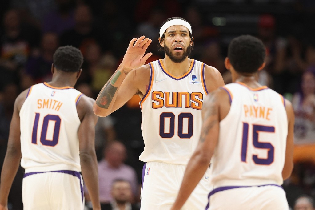 JaVale McGee #0 of the Phoenix Suns high fives Cameron Payne #15 during the NBA preseason game at Footprint Center on October 06, 2021 in Phoenix, Arizona.