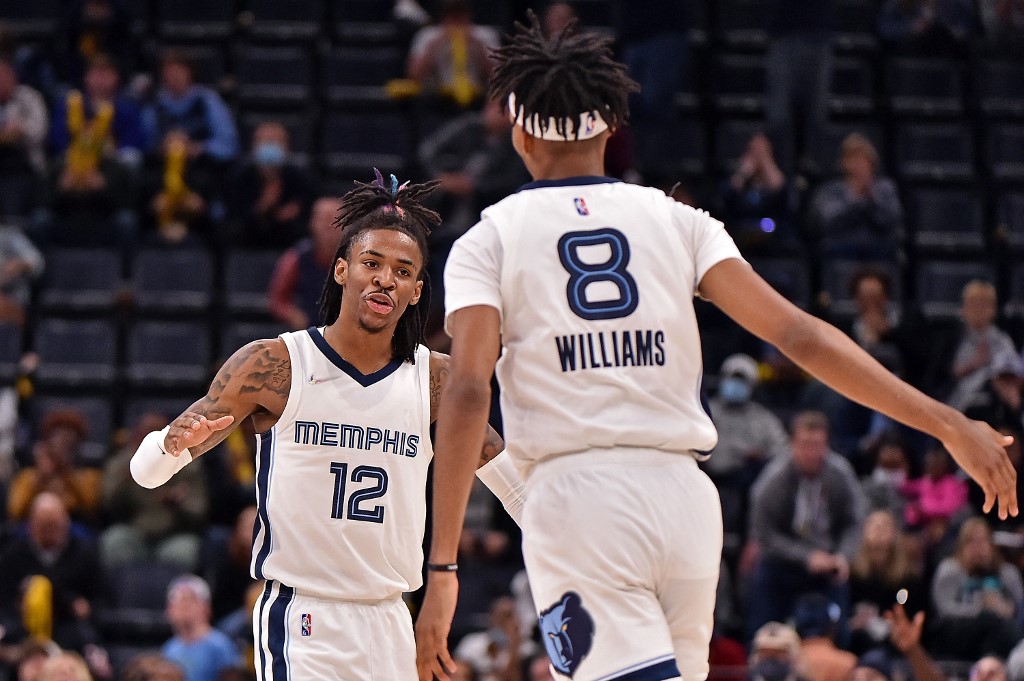 Ja Morant #12 of the Memphis Grizzlies and Ziaire Williams #8 react during the second half against the Denver Nuggets at FedExForum on November 01, 2021 in Memphis, Tennessee.