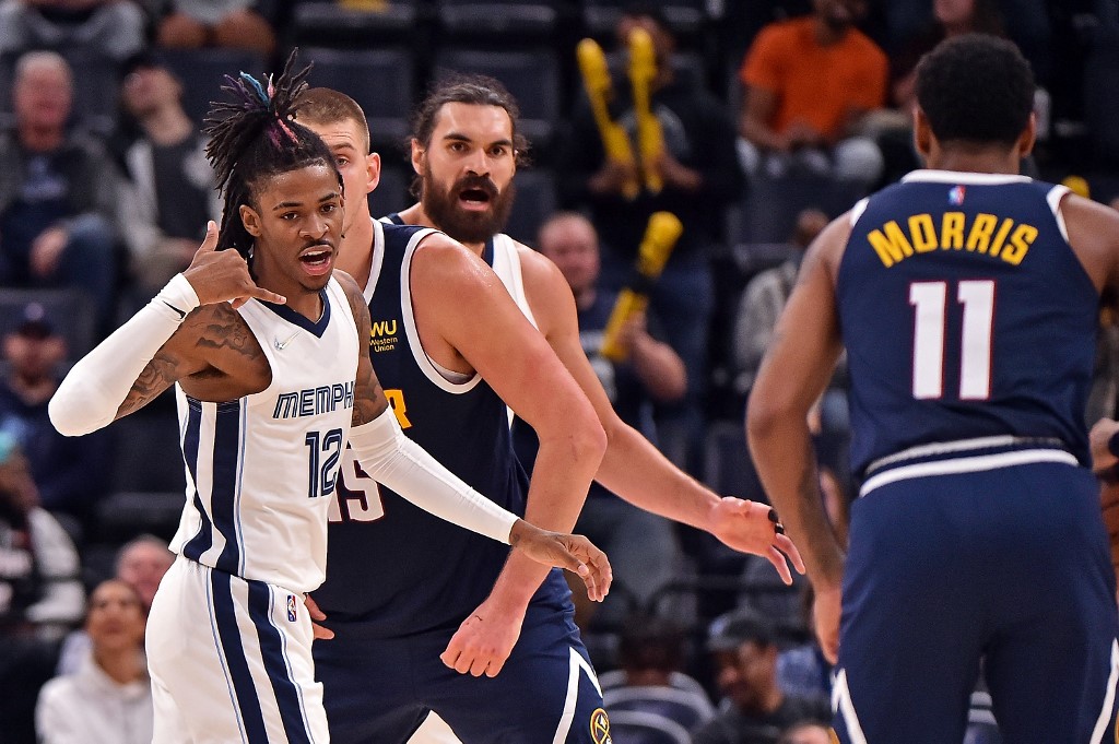  Ja Morant #12 of the Memphis Grizzlies reacts during the second against the Denver Nuggets at FedExForum on November 01, 2021 in Memphis, Tennessee. 
