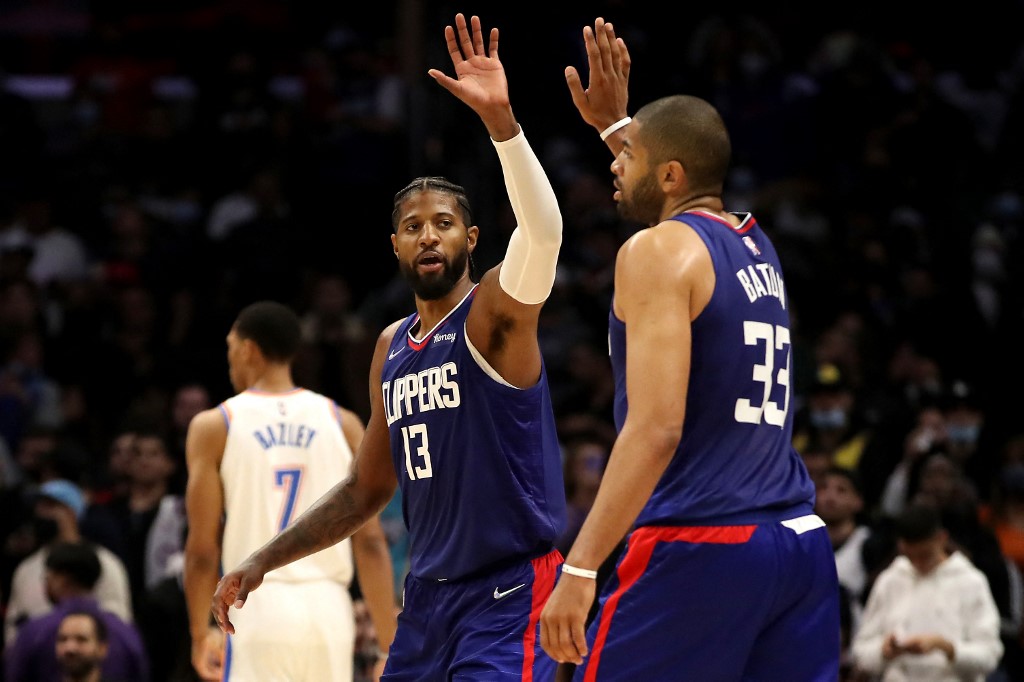  Paul George #13 and Nicolas Batum #33 of the Los Angeles Clippers react after a play d