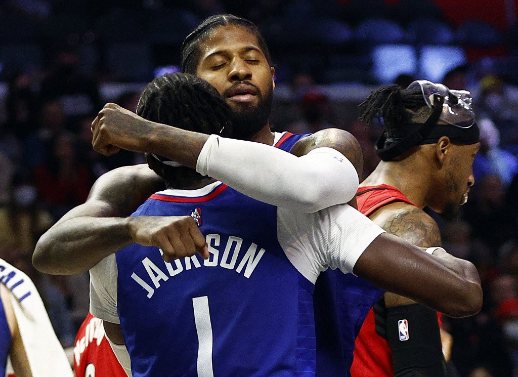 Paul George #13 and Reggie Jackson #1 of the LA Clippers celebrate against the Portland Trail Blazers in the fourth quarter at Staples Center on November 09, 2021 in Los Angeles, California. 