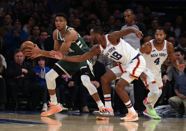NEW YORK, NEW YORK - NOVEMBER 10: Giannis Antetokounmpo #34 of the Milwaukee Bucks in action against Alec Burks #18 of the New York Knicks during their game at Madison Square Garden on November 10, 2021 in New York City. NOTE TO USER: User expressly acknowledges and agrees that, by downloading and or using this photograph, User is consenting to the terms and conditions of the Getty Images License Agreement. Al Bello/Getty Images/AFP (Photo by AL BELLO / GETTY IMAGES NORTH AMERICA / Getty Images via AFP)