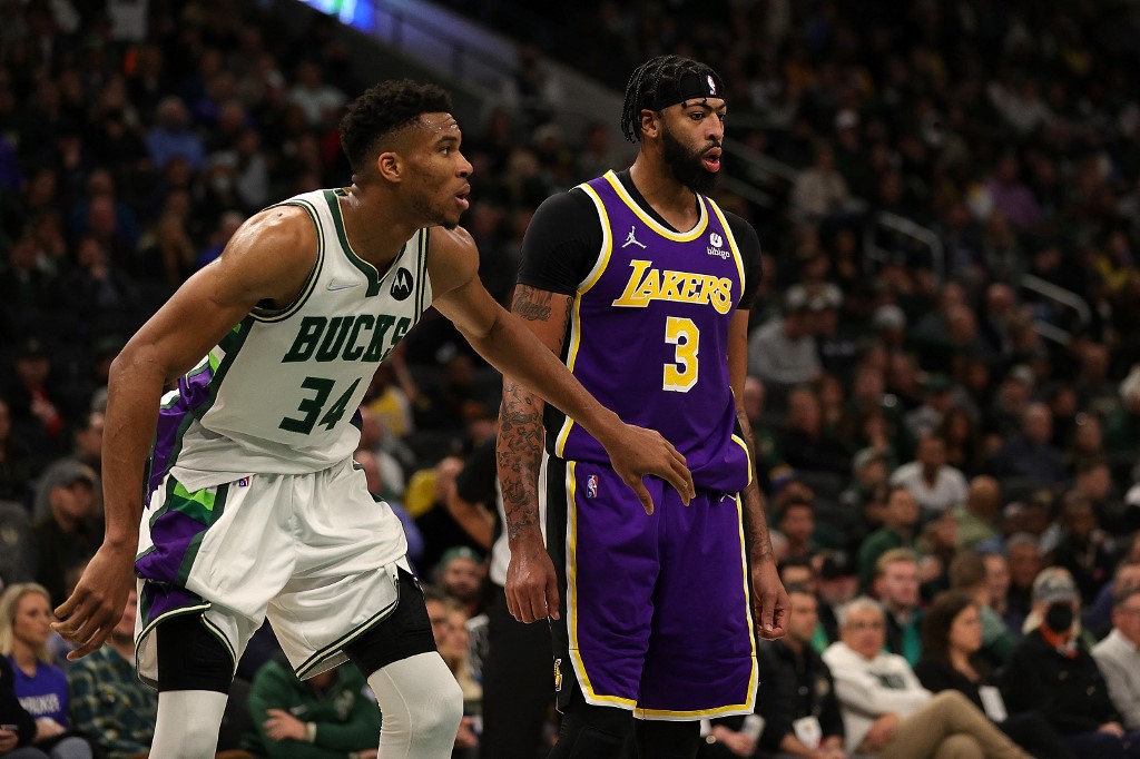 Giannis Antetokounmpo #34 of the Milwaukee Bucks and Anthony Davis #3 of the Los Angeles Lakers wait for a free throw during the second half of a game at Fiserv Forum on November 17, 2021 in Milwaukee, Wisconsin. 