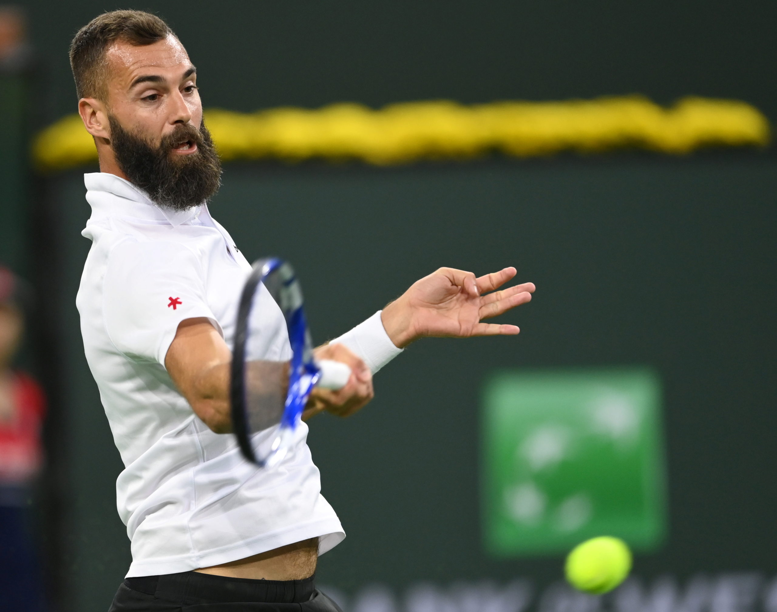 Benoit Paire (FRA) hits a shot during his first round match against Frances Tiafoe (USA) in the BNP Paribas Open at the Indian Wells Tennis Garden